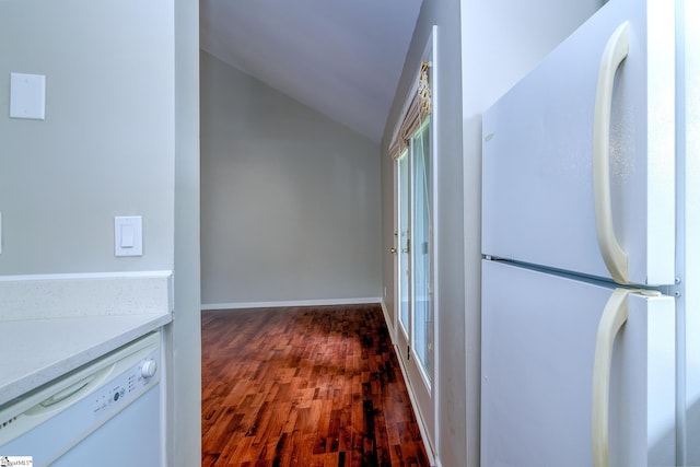 hallway with vaulted ceiling and wood finished floors