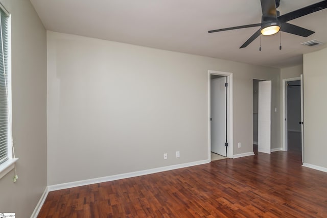 unfurnished bedroom with wood finished floors, baseboards, and ceiling fan
