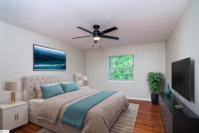 bedroom with wood finished floors, ceiling fan, and baseboards