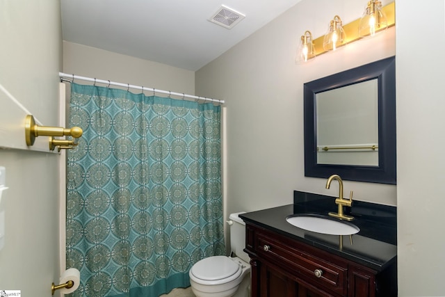 full bathroom featuring toilet, vanity, and a shower with curtain