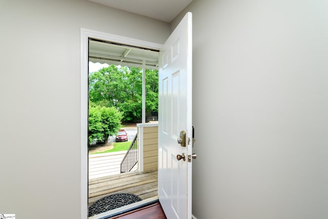 entryway with dark wood finished floors