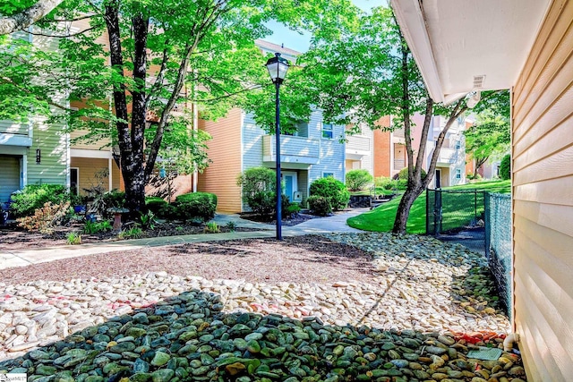 view of property's community with fence