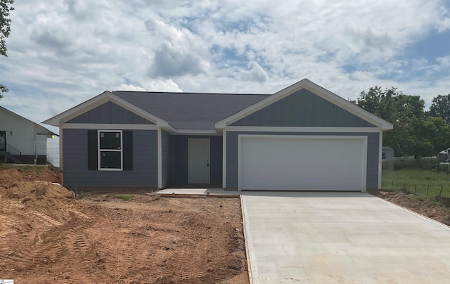 3 Wenck Cir, Fountain Inn, SC 29644 - ranch-style house featuring driveway, an attached garage, and board and batten siding