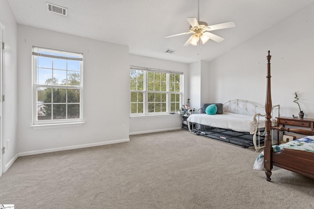 bedroom featuring carpet floors, baseboards, lofted ceiling, and a ceiling fan