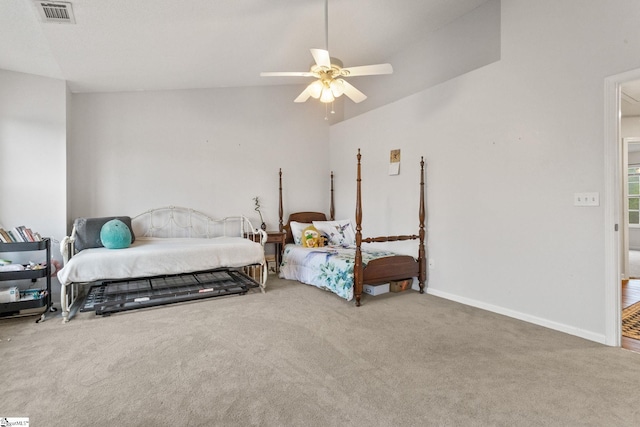 bedroom featuring carpet, baseboards, vaulted ceiling, and ceiling fan