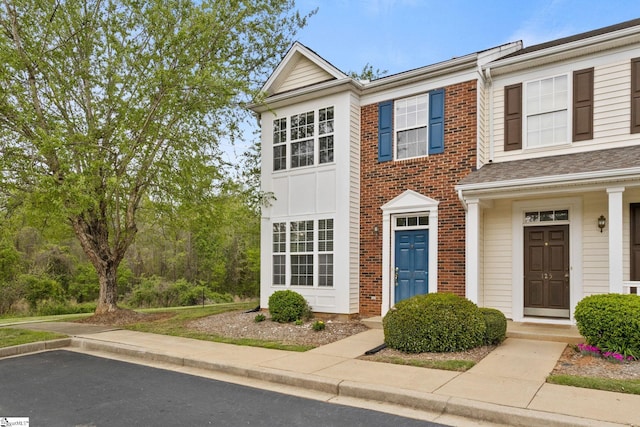 multi unit property featuring brick siding