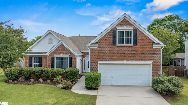 325 Waterton Way, Simpsonville, SC 29680 - traditional home with brick siding, an attached garage, and driveway