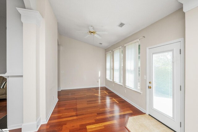 325 Waterton Way, Simpsonville, SC 29680 - unfurnished room featuring healthy amount of natural light, a ceiling fan, wood finished floors, lofted ceiling, and baseboards