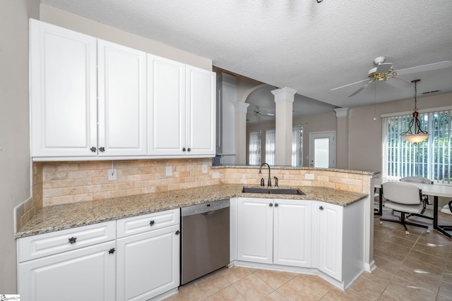 325 Waterton Way, Simpsonville, SC 29680 - kitchen featuring dishwasher, a sink, a ceiling fan, ornate columns, and a textured ceiling