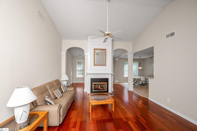 325 Waterton Way, Simpsonville, SC 29680 - living room featuring arched walkways, decorative columns, a ceiling fan, plenty of natural light, and high vaulted ceiling