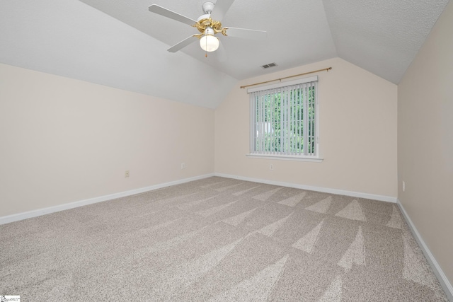 325 Waterton Way, Simpsonville, SC 29680 - bonus room featuring lofted ceiling, carpet floors, baseboards, ceiling fan, and a textured ceiling