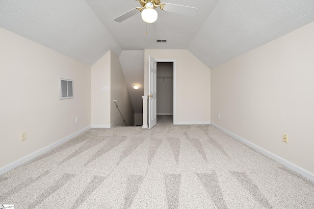 325 Waterton Way, Simpsonville, SC 29680 - bonus room with vaulted ceiling, carpet floors, ceiling fan, baseboards, and a textured ceiling