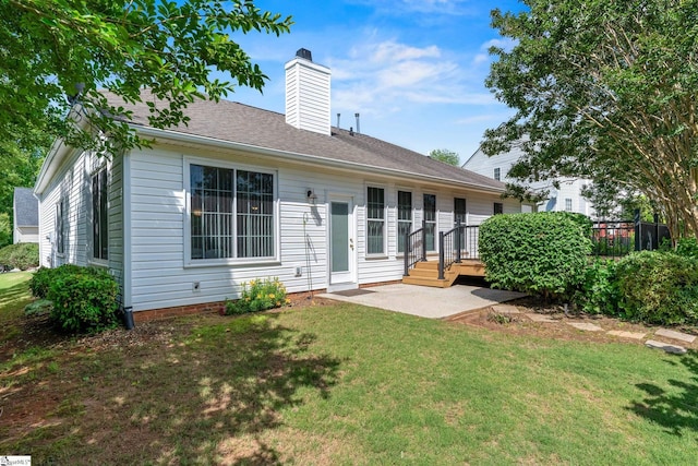 325 Waterton Way, Simpsonville, SC 29680 - back of property with a chimney, a patio area, and a lawn