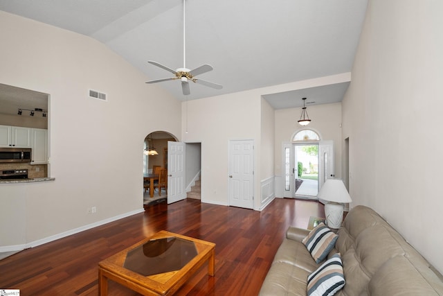 325 Waterton Way, Simpsonville, SC 29680 - living room with wood finished floors, stairs, arched walkways, a ceiling fan, and high vaulted ceiling