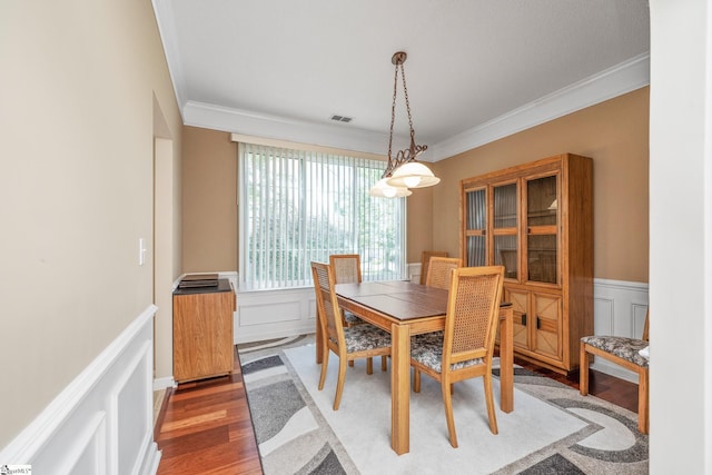 325 Waterton Way, Simpsonville, SC 29680 - dining room featuring crown molding, light wood-style floors, wainscoting, and a decorative wall