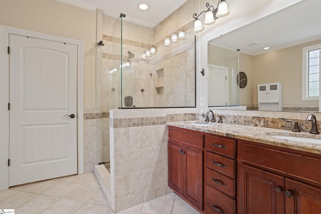 6 Pebble Stone Ln, Taylors, SC 29687 - bathroom featuring tile patterned flooring, a walk in shower, double vanity, ornamental molding, and tile walls