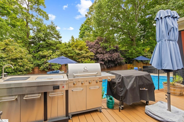6 Pebble Stone Ln, Taylors, SC 29687 - deck with a sink, grilling area, fence, and an outdoor kitchen