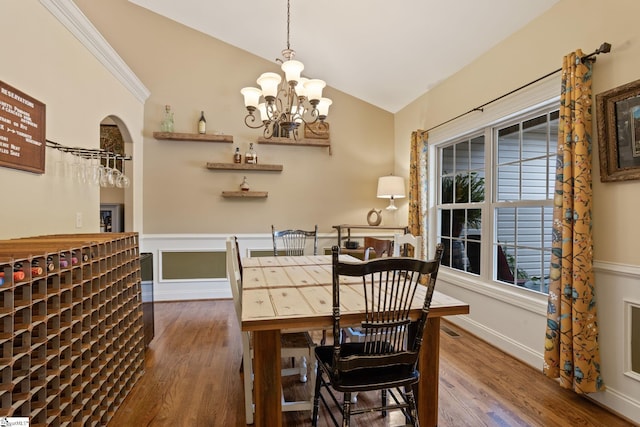 6 Pebble Stone Ln, Taylors, SC 29687 - dining area featuring wood finished floors, lofted ceiling, a chandelier, and wainscoting
