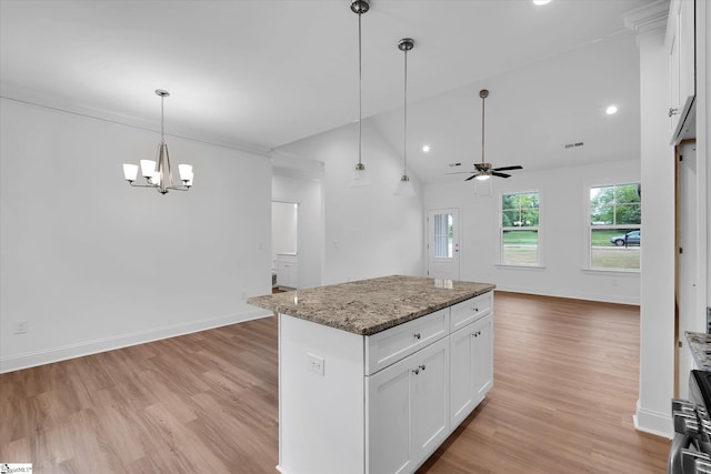 107A W Stewart St, Pelzer, SC 29669 - kitchen with open floor plan, a ceiling fan, light wood finished floors, a chandelier, and white cabinets