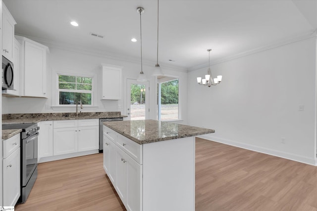 107A W Stewart St, Pelzer, SC 29669 - kitchen with appliances with stainless steel finishes, light wood-type flooring, a kitchen island, a sink, and ornamental molding
