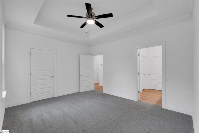 107A W Stewart St, Pelzer, SC 29669 - unfurnished bedroom with carpet flooring, a raised ceiling, ornamental molding, baseboards, and ceiling fan
