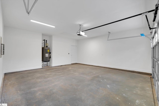 107A W Stewart St, Pelzer, SC 29669 - garage featuring electric water heater, a garage door opener, and baseboards