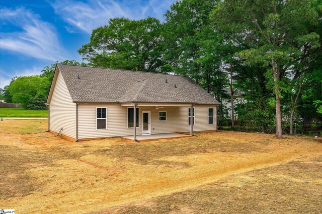 107A W Stewart St, Pelzer, SC 29669 - back of property featuring a patio area and roof with shingles