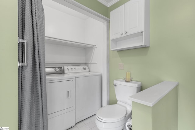 bathroom with separate washer and dryer, toilet, and tile patterned floors
