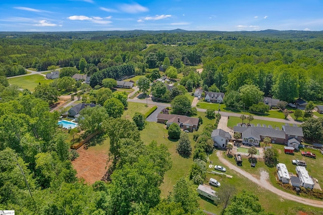 drone / aerial view of a heavily wooded area