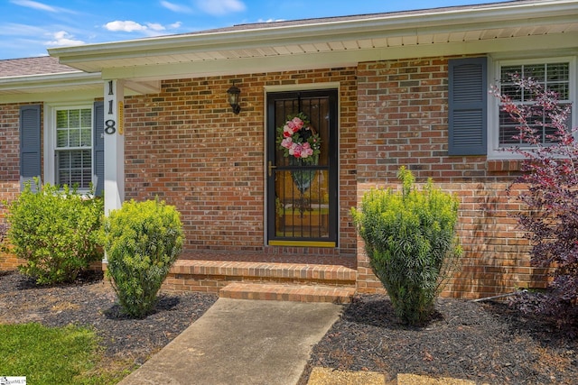 entrance to property with brick siding
