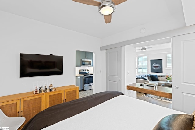 bedroom featuring light wood-type flooring and ceiling fan