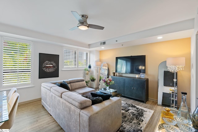 living room featuring a ceiling fan, light wood-style flooring, baseboards, and recessed lighting