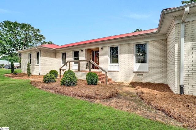 103 Mississippi Dr, Clinton, SC 29325 - ranch-style home with a front lawn, brick siding, and metal roof