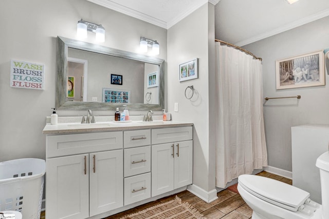 103 Mississippi Dr, Clinton, SC 29325 - bathroom with toilet, crown molding, wood finished floors, double vanity, and baseboards