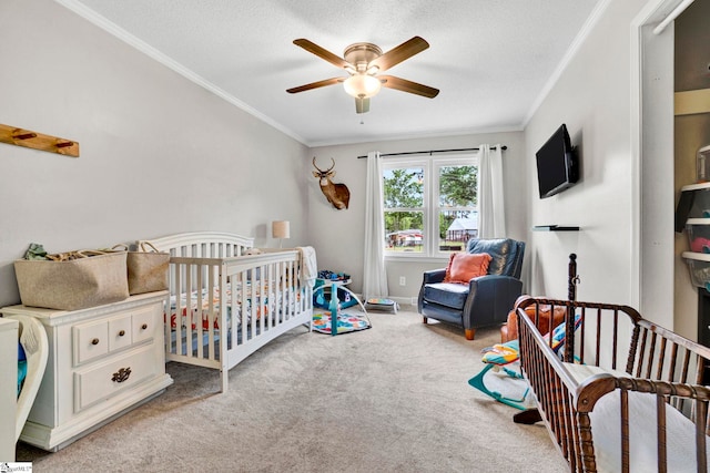 103 Mississippi Dr, Clinton, SC 29325 - bedroom featuring ornamental molding, carpet flooring, a crib, ceiling fan, and a textured ceiling