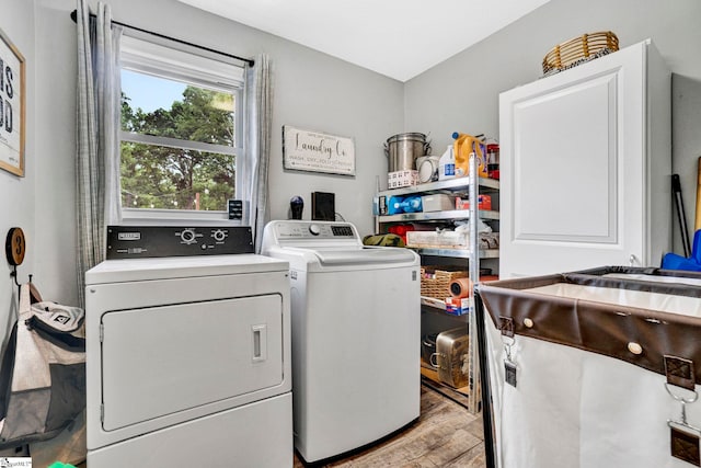 103 Mississippi Dr, Clinton, SC 29325 - clothes washing area featuring washing machine and dryer and light wood-type flooring