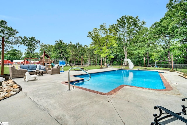 103 Mississippi Dr, Clinton, SC 29325 - view of swimming pool featuring a water slide, a patio, fence, view of wooded area, and an outdoor living space