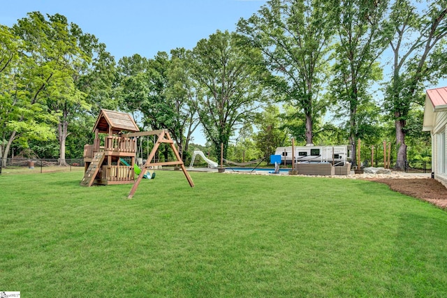 103 Mississippi Dr, Clinton, SC 29325 - view of yard featuring a playground and view of wooded area