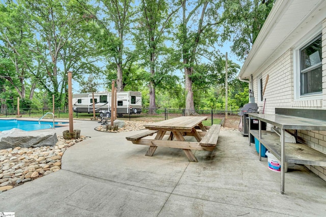 103 Mississippi Dr, Clinton, SC 29325 - view of patio with grilling area, outdoor dining area, a fenced backyard, and view of wooded area