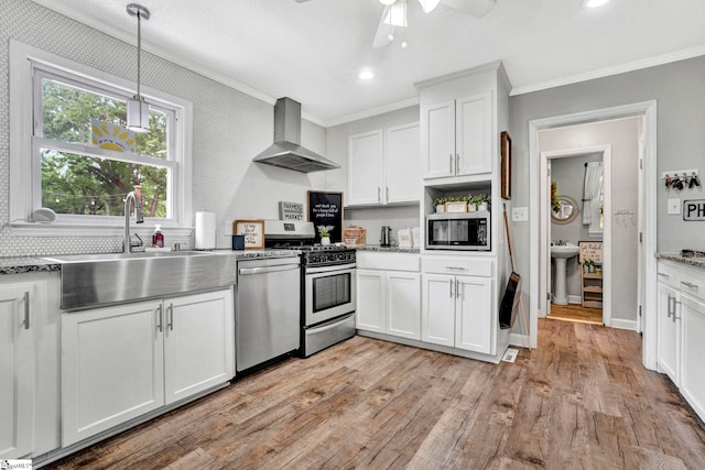 103 Mississippi Dr, Clinton, SC 29325 - kitchen featuring appliances with stainless steel finishes, wall chimney exhaust hood, ornamental molding, a sink, and a ceiling fan