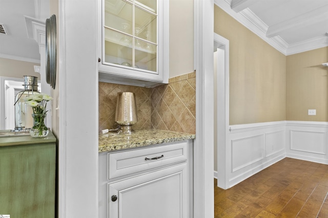 101 Belgian Blue Way, Fountain Inn, SC 29644 - bar area featuring ornamental molding, dark wood-type flooring, decorative backsplash, and wainscoting