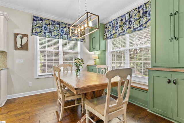 101 Belgian Blue Way, Fountain Inn, SC 29644 - dining room with ornamental molding, a chandelier, dark wood-type flooring, and baseboards