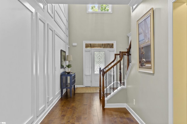 101 Belgian Blue Way, Fountain Inn, SC 29644 - foyer entrance featuring dark wood-style floors, a towering ceiling, stairs, and baseboards