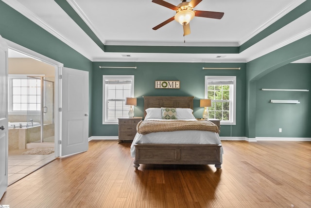 101 Belgian Blue Way, Fountain Inn, SC 29644 - bedroom with wood finished floors, a raised ceiling, ornamental molding, baseboards, and arched walkways