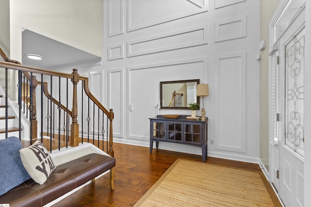 101 Belgian Blue Way, Fountain Inn, SC 29644 - foyer entrance featuring a decorative wall, wood finished floors, stairway, and a high ceiling