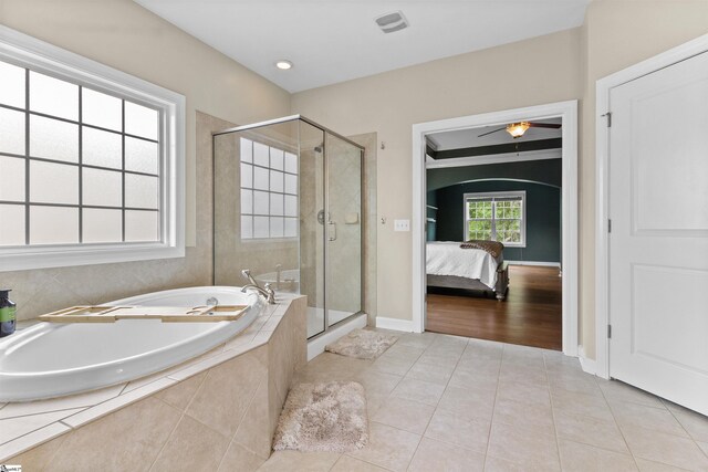101 Belgian Blue Way, Fountain Inn, SC 29644 - full bathroom featuring tile patterned flooring, a garden tub, a stall shower, a ceiling fan, and ensuite bathroom