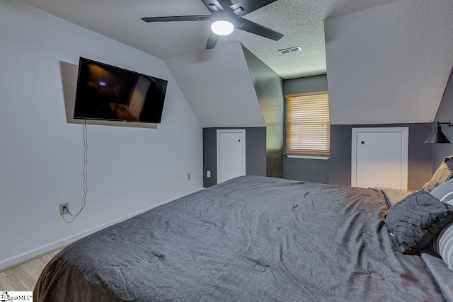 221 Twin Falls Dr, Simpsonville, SC 29680 - bedroom featuring vaulted ceiling, a textured ceiling, ceiling fan, and wood finished floors