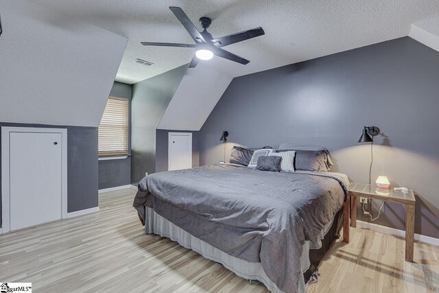 221 Twin Falls Dr, Simpsonville, SC 29680 - bedroom with baseboards, light wood-style flooring, a textured ceiling, lofted ceiling, and a ceiling fan
