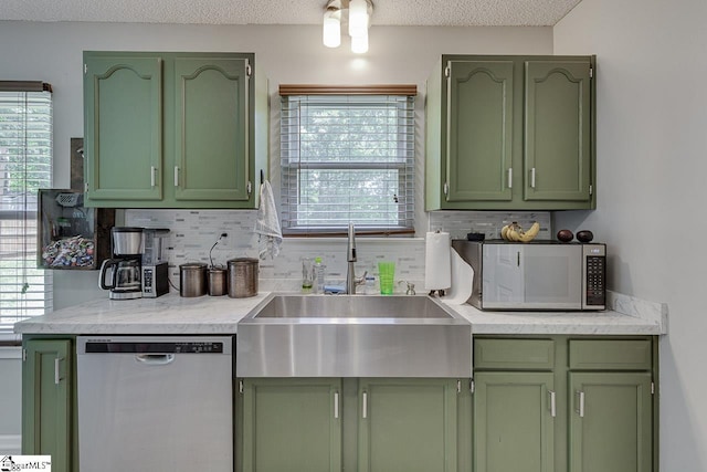 221 Twin Falls Dr, Simpsonville, SC 29680 - kitchen featuring green cabinetry, stainless steel appliances, a sink, tasteful backsplash, and a textured ceiling