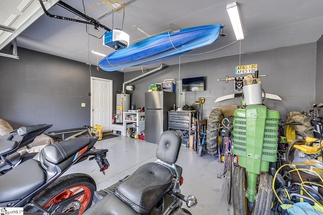 221 Twin Falls Dr, Simpsonville, SC 29680 - garage featuring freestanding refrigerator, a garage door opener, and water heater